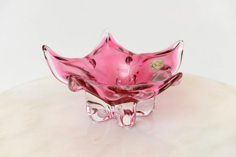 Czech star luscious pink glass pedastel bowl with the  original sticker from the 60's . It has a great presence with it;s arresting
color and shape.