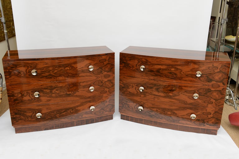 These absolutely stunning, rare and beautifully restored pair of rosewood chest/commodes signed by Gilbert Rohde for Herman Miller  are rare and very special... they have their original round pulls that have been nickeled silver. The metal name tag