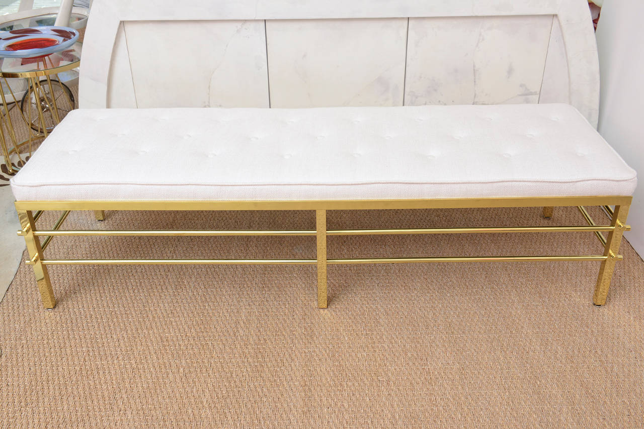 The lines, the weight, the quality, the beauty, the simplicity, the elegance, the timeless modernity of this rare very heavy polished Tommi Parzinger Mid-Century Modern brass bench says it all and then some. It is looks so modernist in today's