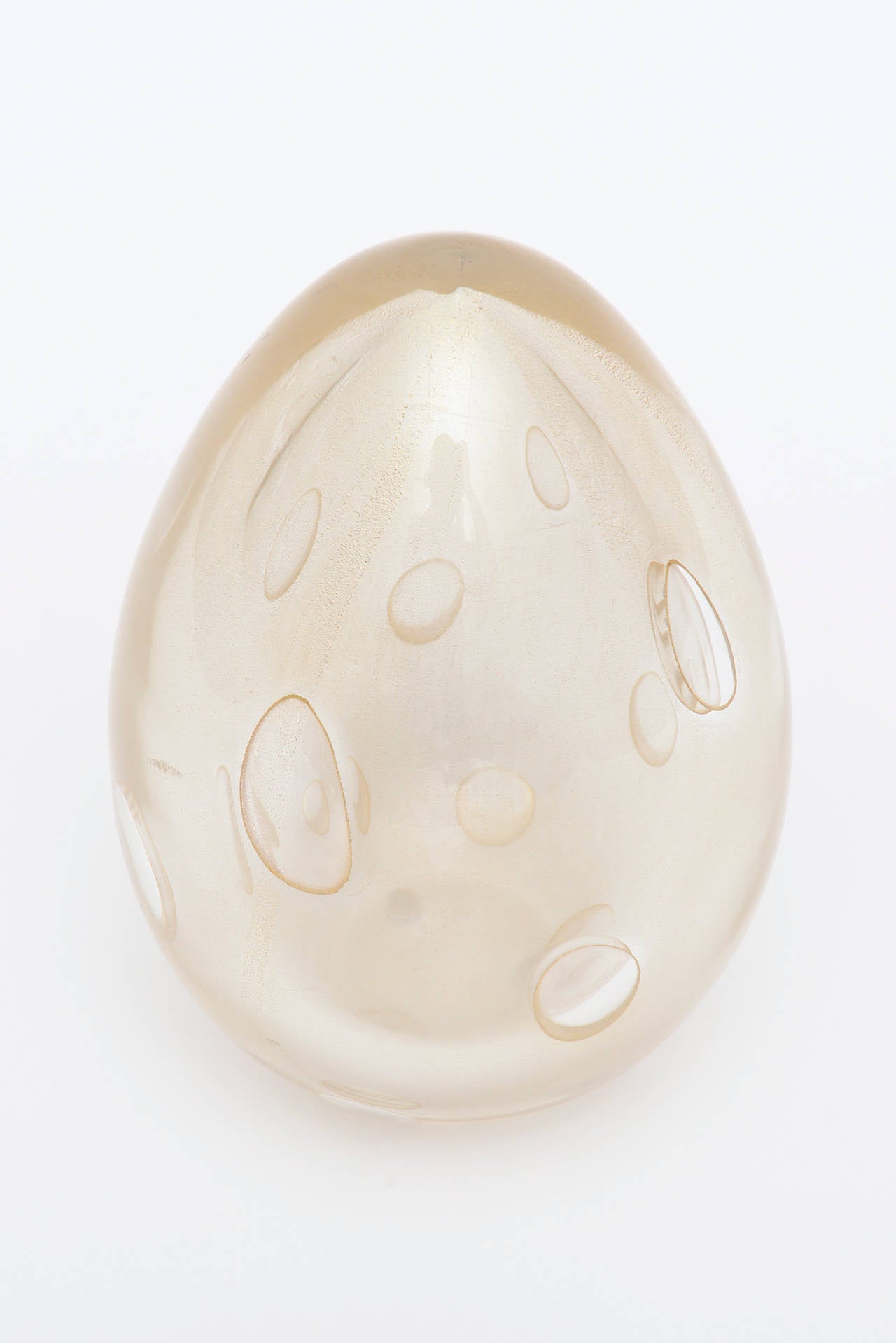 This wonderful Archimede Seguso Italian Murano Mid-Century Modern vintage sculptural piece of beautiful glass is in the shape of an ovoid or egg form. The open areas where there are large almond teardrops that almost look like craters. They are