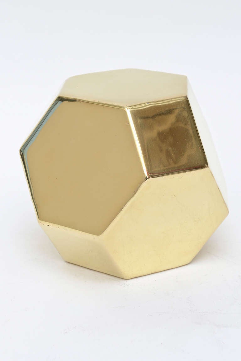 Great object; great sculpture! 10 sides make up this French polished brass table top Dodecahedron sculpture.
Heavy and substantial.
It changes from every angle.