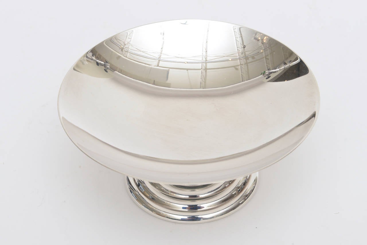 This lovely French Art Deco silver plate tazza bowl or coupe is hallmarked with the Puiforcat.
France on the bottom and the square of the initials of the makers mark: Jean Puiforcat.
It has been polished.
The middle is malachite resin and has the