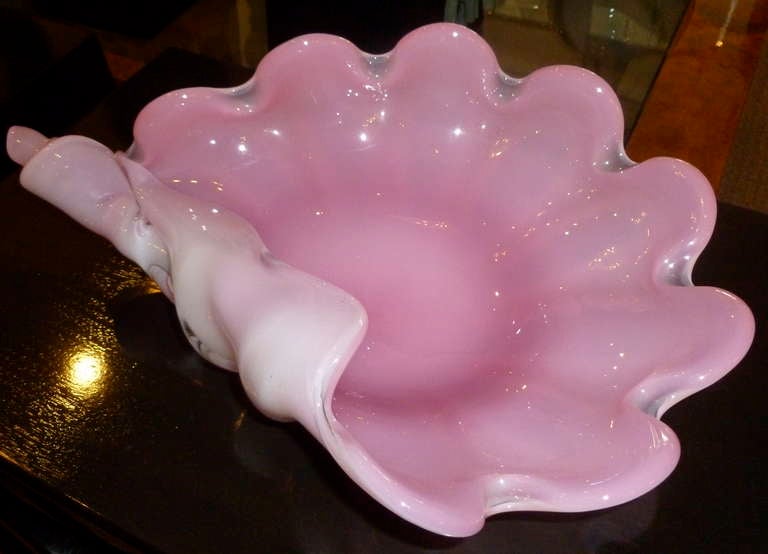 Luscious pink with opalescent make these stunning and extra large Italian Murano glass centerpiece bowl or platter a beautiful addition to any table.
The play of light changes the color of this bowl as shown in the photos. The pink is truly divine.