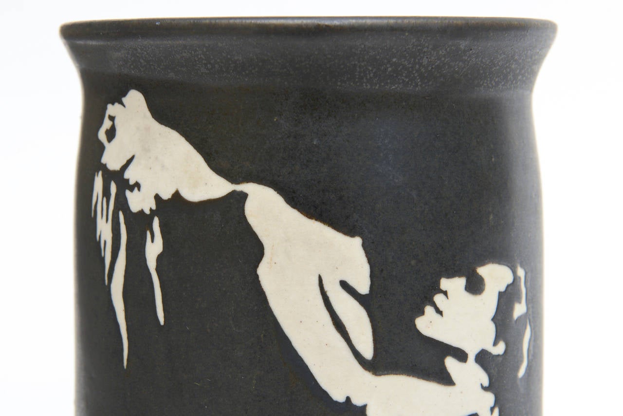 This wonderful erotic and visual ceramic vase hallmarked Morrision with letters Do nn on the bottom has all the makings for elicit conversation. The potter was Morrison Black background with off-white male/female forms. Rare!
Sensual!!! Never seen
