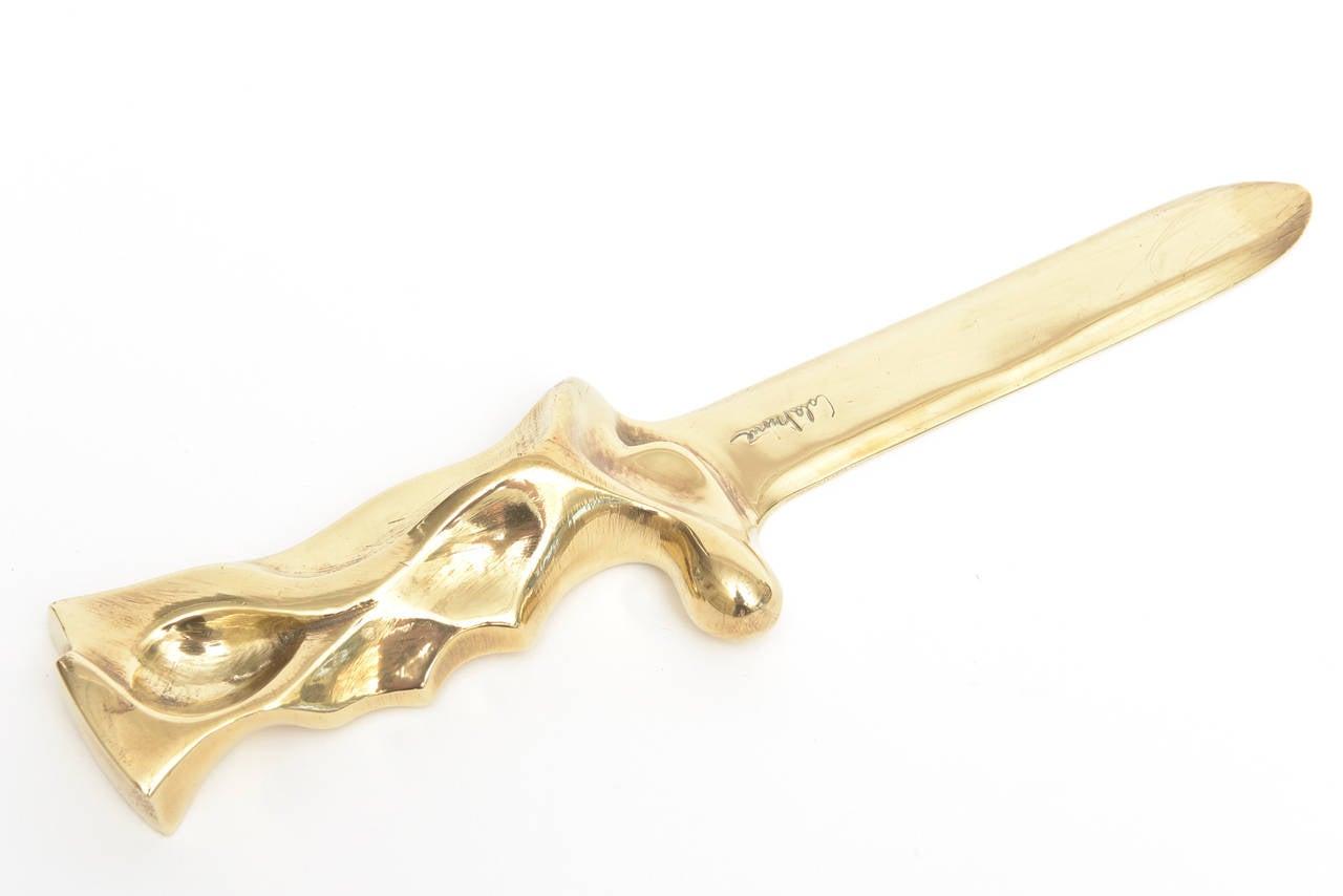This amazing sensual and sculptural heavy polished bronze letter opener, desk accessory or object is signed and one of a kind. The signature is hard to read but looks like Lola Brome. Lola is definitely the first name.
It is a piece of art and