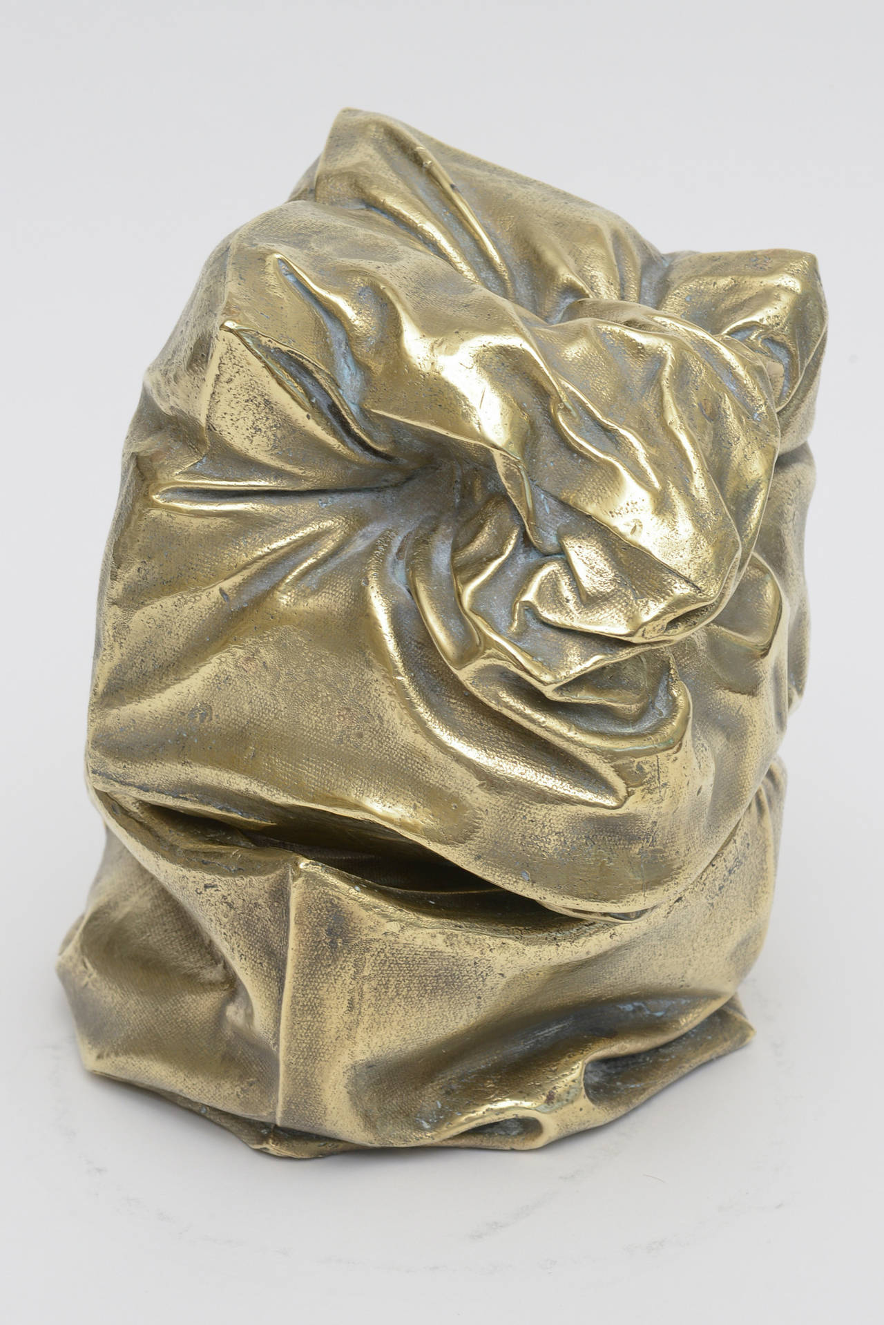 This amazingly very heavy signed 2 part crushed and folded Bag/Box sculpture is polished bronze with gold patina. It has has different forms from each angle.
It is one of one... only one made... It is signed Kanter; probably French and with a