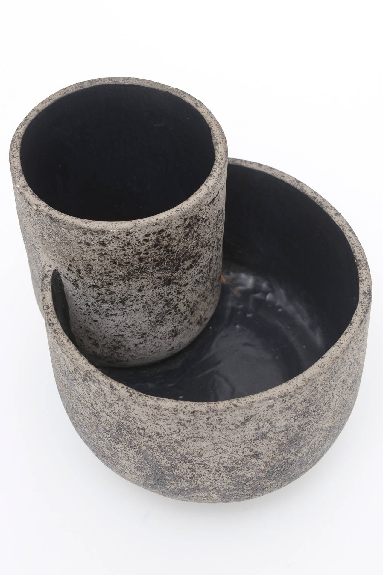 The interesting shapes and forms of this two-part, two-tiered sculptural Japanese Zen vase or vessel has 
the feel and look of ancient civilizations with a modern sculptural presence.
It has a flat texture but looks raised.
The more interesting