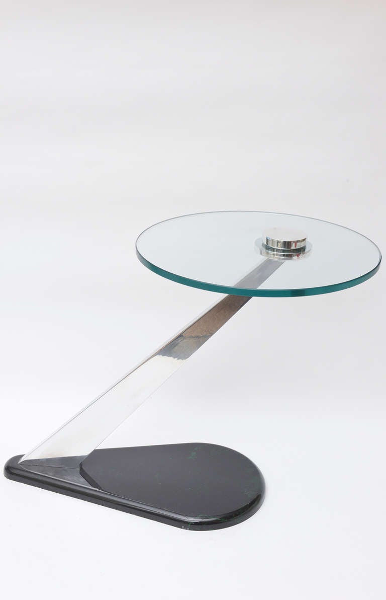 The base is dark green over black resin in a teardrop shape base.
The angled nickel silver over brass  connector and screw on top has all been
polished.
The table is quite sculptural!
The glass top is 16