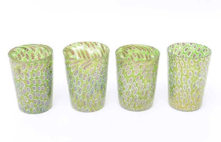 The gorgeous chartreuse background with purple, white and gold aventurine murrains
screams luscious!!!

These beautiful hand blown Italian Murano glasses/tumblers are in the Soffiato technique and probably either the work of Zecchin or Capellini