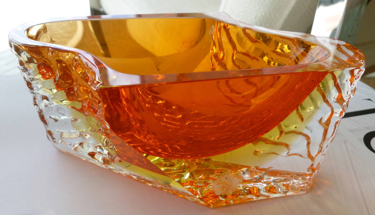 This very unique and stunning faceted and textured double Sommerso Italian Murano glass bowl has the most amazing colors. The Sommerso of orange with the bottom yellow is a rare combination of colors. The glass is textured and pebbled on two