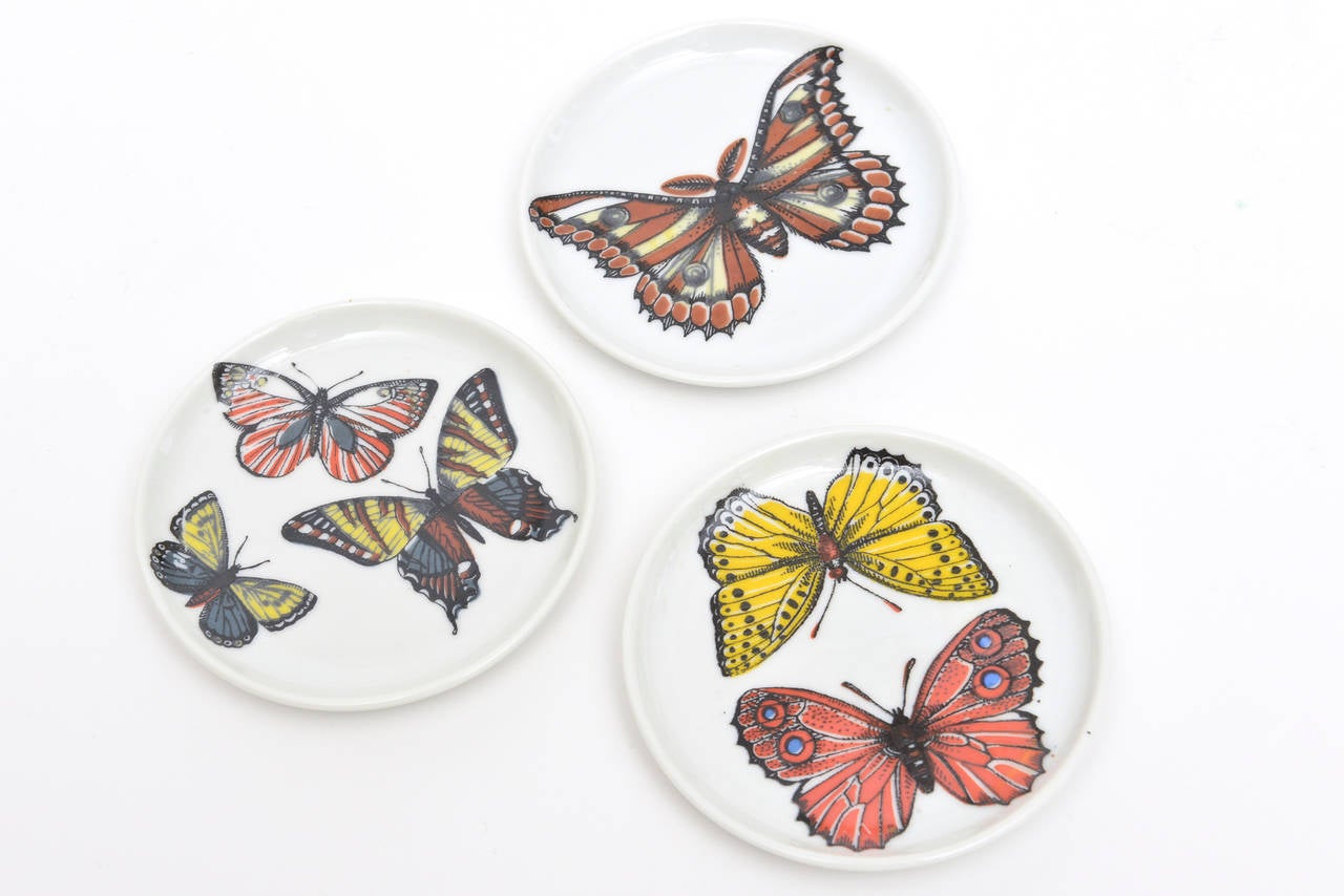 This special set of 8 porcelain coasters by Fornasetti has beautiful images of butterflies in arresting colors.
They are early and have their own special unusual box that comes with it.
They are called 