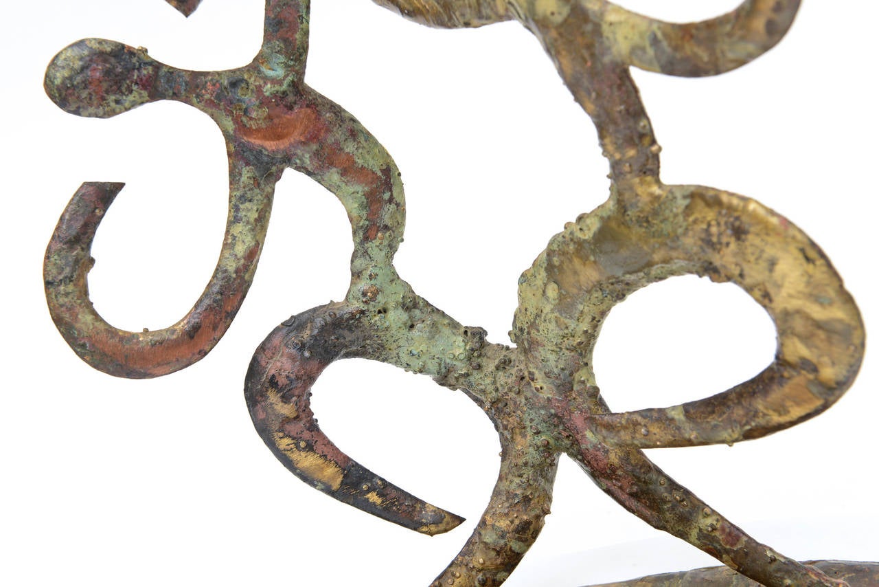 The two connecting abstract bodies look like dancers in motion. The mixed metals of the bodies are variegated patinas. Copper, brass, bronze and paint with gold leaf are the materials. There is a coating on the sculpture. THIS IS ONE OF...
The oval