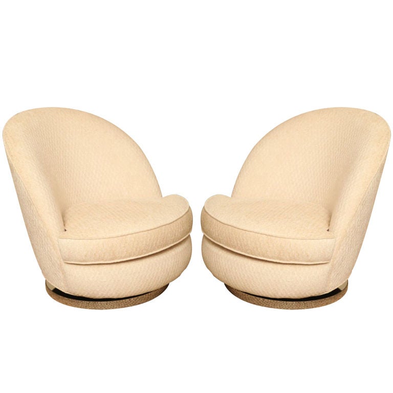 Gorgeous pair of swivel chairs with chrome banding base. Newly upholstered and cushioned. Sold exclusively as a pair.
