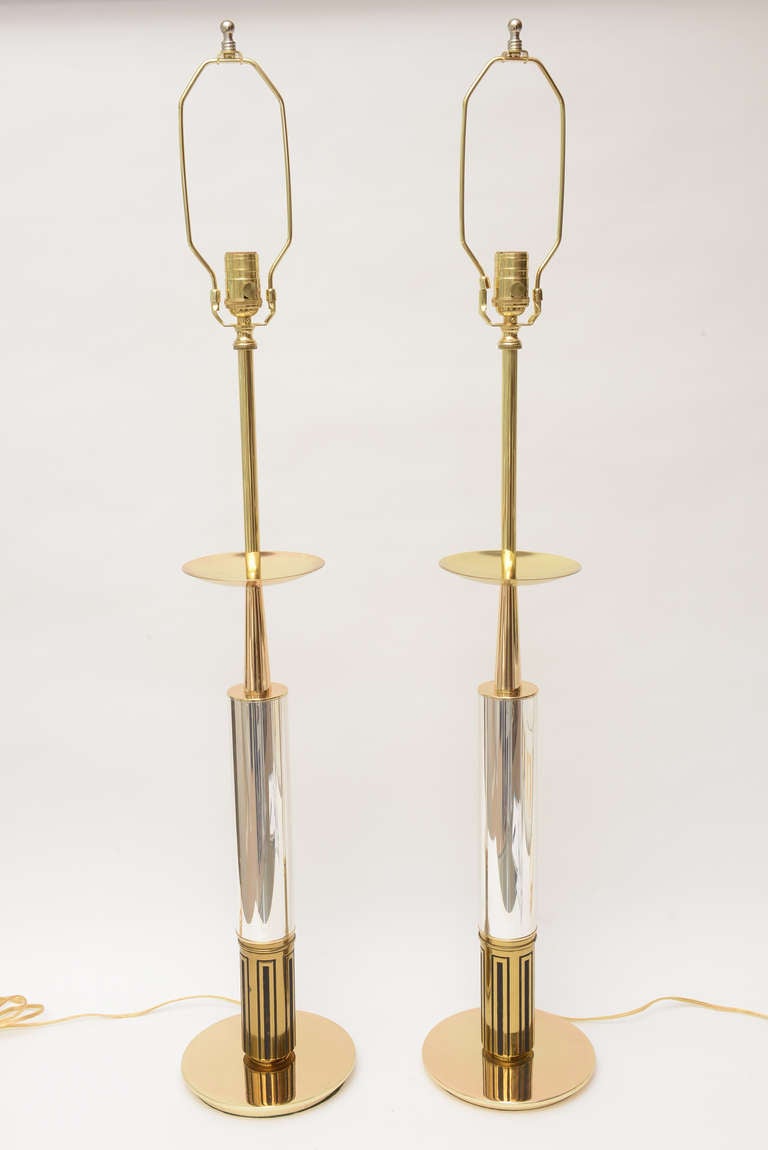 These amazing two metal tall gorgeous Mid-Century Modern lamps are the work of Tommi Parzinger. They are silver plate and polished brass with black metal inlay. Handsome, timeless and regal! Polished to perfection. It does not get much better than