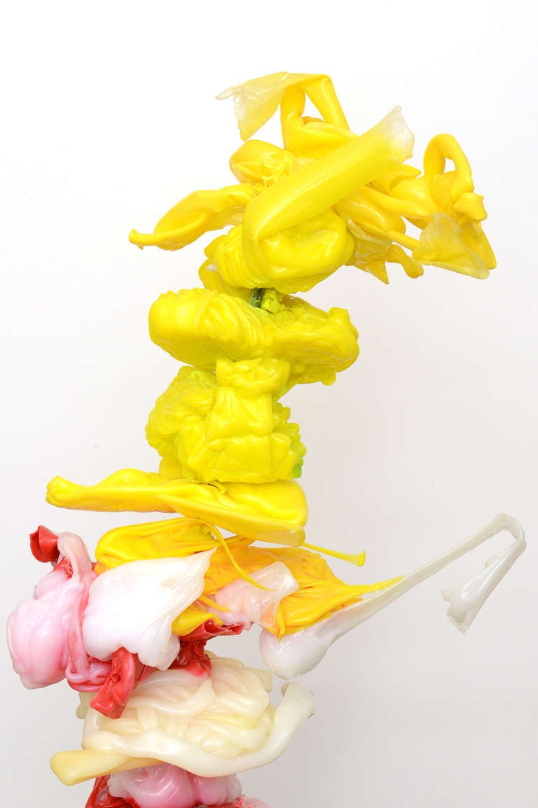 The leaning tower of a birthday cake of a mixed-media resin sculpture is the work of Italian artist, Gaetano Pesce .What a great piece of art and sculpture in brilliant colors of rich resin of red, yellow, pink, white and off-white. There is a brass