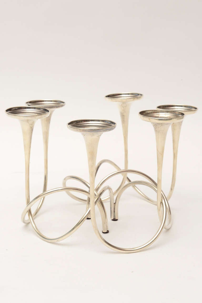 These sculptural lovely candlesticks/orchid vases can be interchanged in free sculptural form as the 3 candlesticks move to form different configurations.
They are very versatile.
They are sterling silver and hallmarked Gorham. They are called