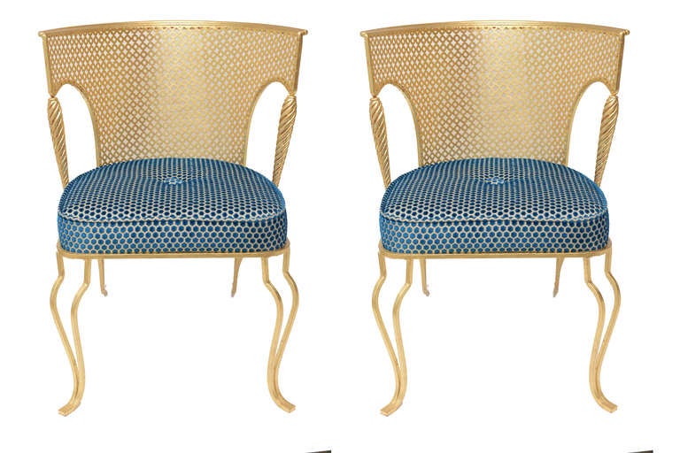 These wonderful 1960's Moroccon influence of these Italian pair of side/boudoir chairs
have a great look!
The real gold leaf over iron is so rich looking. The new upholstery is Belgium silk chenille in sapphire and off white.
The seat depth is 19