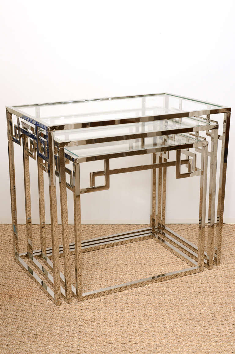 These wonderful greek key nickel silver over brass nesting tables have the clear starfire glass.
They are italian.
They graduate in size and fit under each other for storage.
The largest size is listed below towards the bottom of this