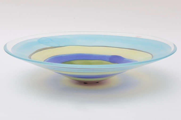 This wonderful heavy Italian Murano glass bowl has the original label of Oggetii and signed by R. Pele, a Lithuian glass blower.
The colors are gorgeous! This has the look of a Kenneth Noland painting.
The concentric design of the bullseye is