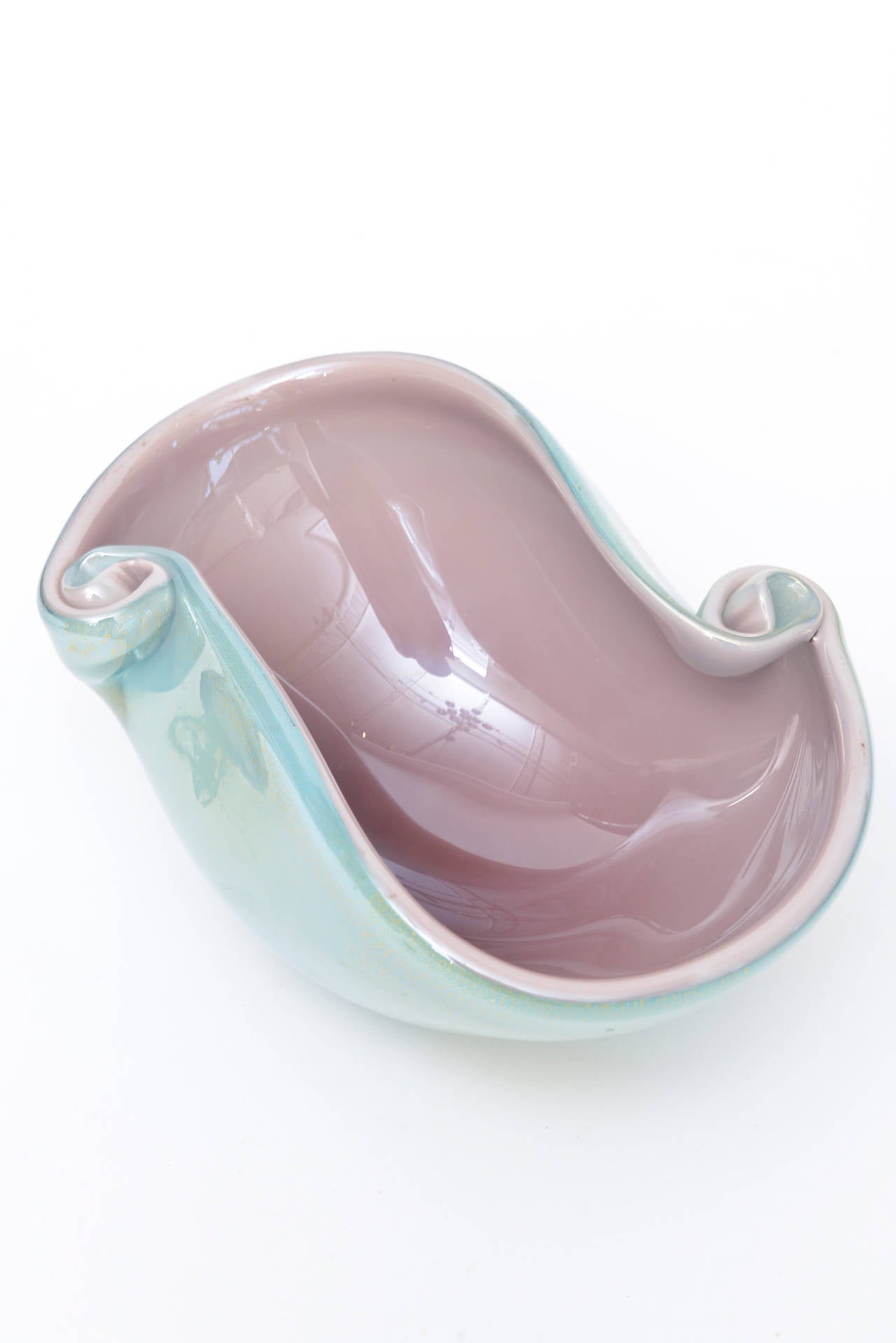 The beautiful interior of light aubergine dusty rose purple meets the exterior of turquoise with gold aventurine in this Italian vintage Murano glass bowl by Barovier e Toso. There is an abundance of gold aventurine on the sides and bottom over the