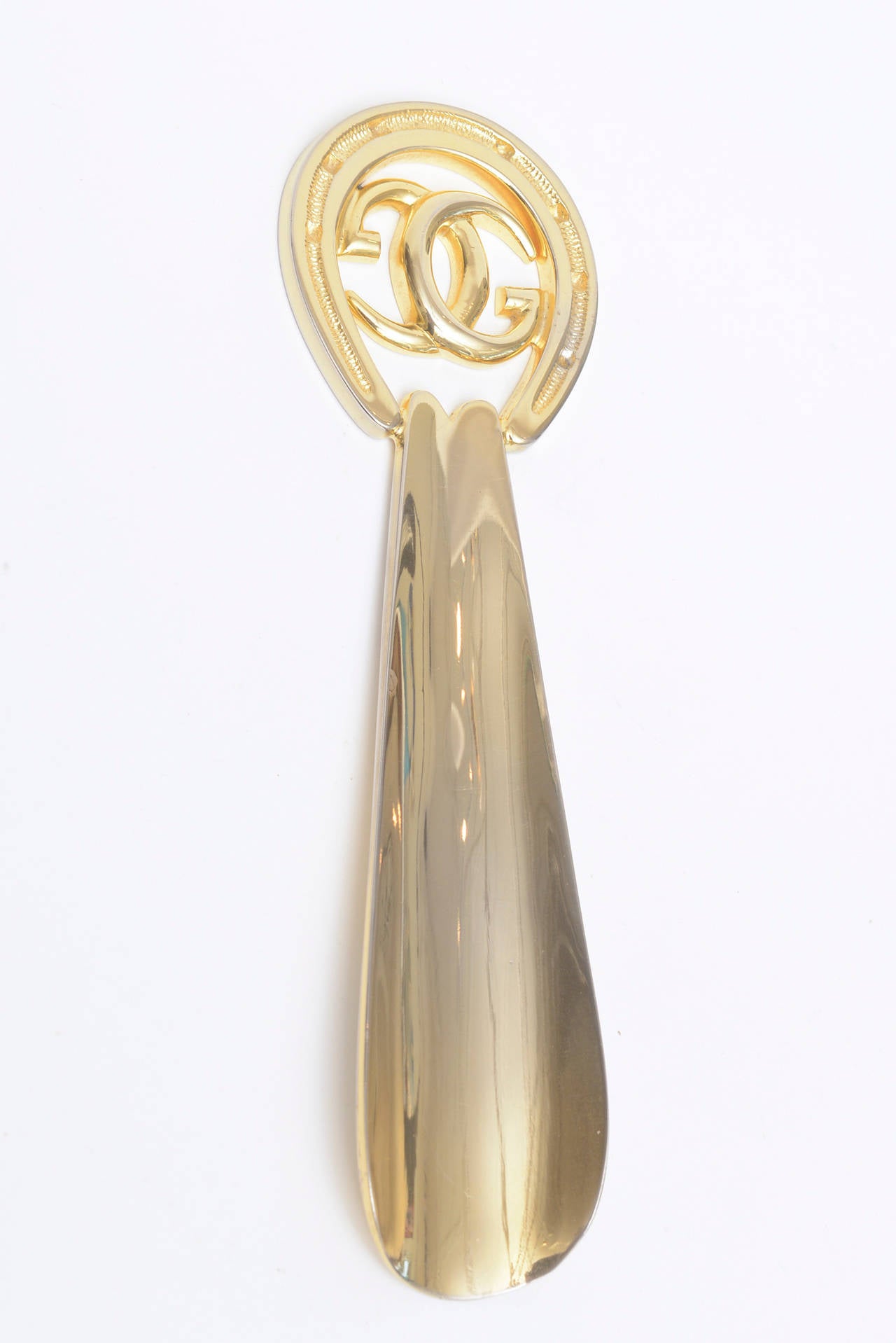 Gucci shoe horn gold sale