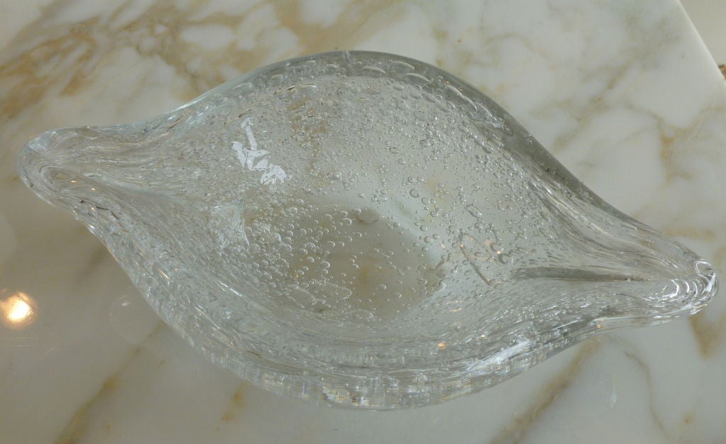 This clear almond shaped Blenko bowl is infused with the internal bubbles called Pulegoso technique. It is clear but has the allusion of white, because of all the fabulous bubbles. This is from the raindrop series. It is a great form that looks like