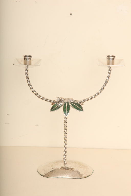 Beautiful workmanship from the Los Castillo Family; this hand hammeredsilverplate and hand wrought large signed candelbra has inlaid mosaic stone. The beautiful twisted rope-like arms give this an interesting element. The resting jaguar sits atop