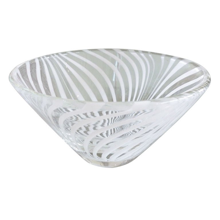 This lovely Swedish optical swirled white glass and clear bowl is perfect for serving nuts, candies, and other delights. It is also great for barware.
From the 1950s.