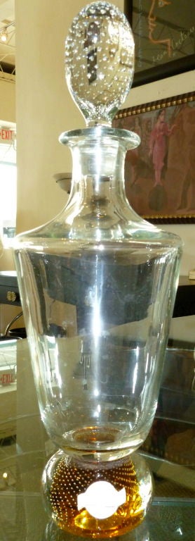 Great Bohemian Czech decanter with originial paper label.The balled bottom is infused with amber glass bubbles. The stopper is also infused with clear bubbles.<br />
Perfect for any bar, or serving tray.