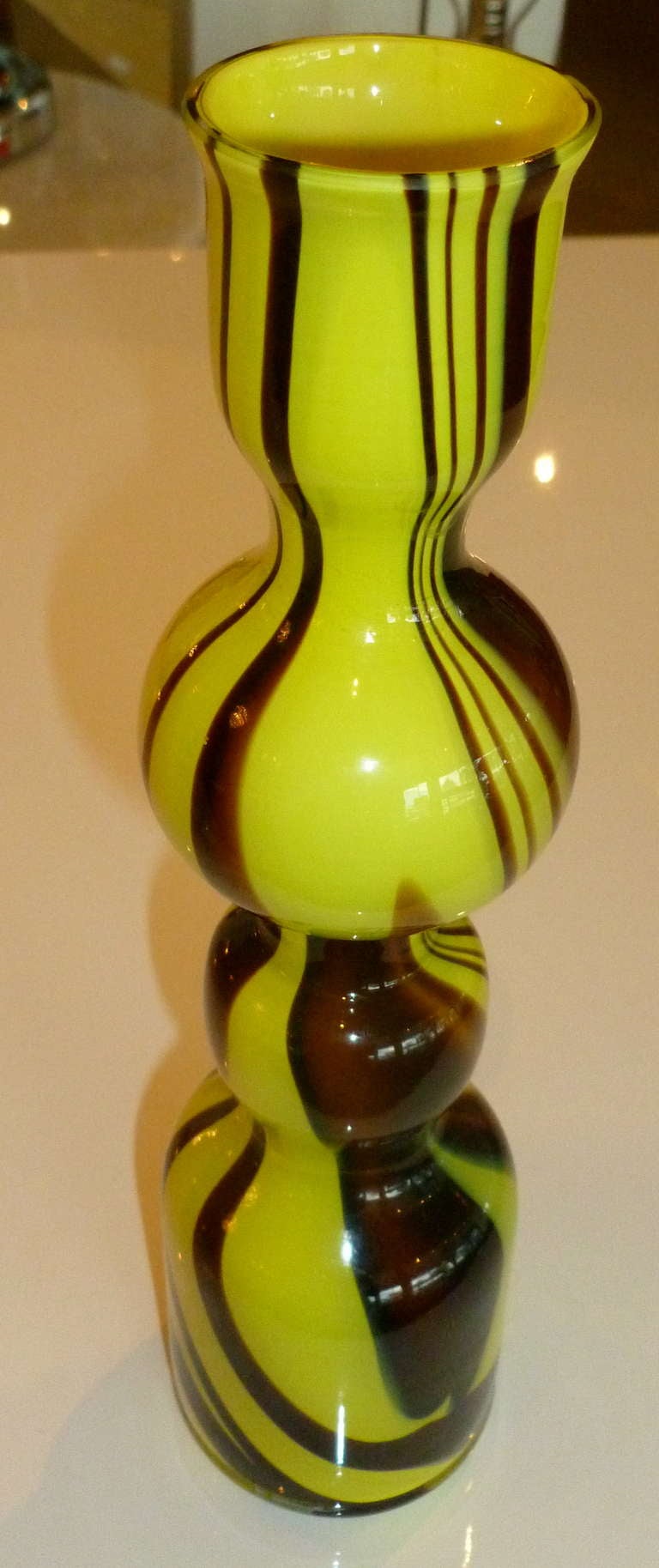 Sensual swirls of painted like color are in this gorgeous vintage Italian Murano glass vase by Carlo Moretti. Lemon yellow meets aubergine/amethyst in this stunning brilliant glass small vase. Its twisted swirls give momentum and movement. Luscious!
