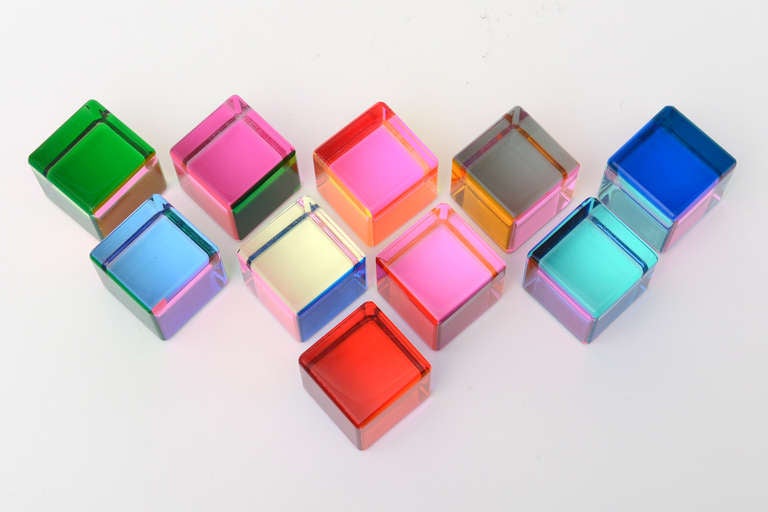 This collection of ten amazing colorful and ever changing laminated acrylic cube sculptures
can be arranged in a multitude of forms and shapes. They change color with each turn of the cube.
The colors change from every angle and lay of light. One