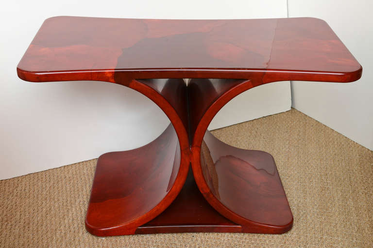 The luscious variants of the different colors of the red goatskin side table by Karl Springer are superb!!!!
This is a piece de resistance!! of a stellar table in great condition!!