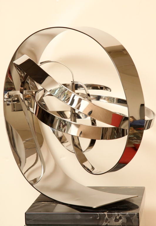 This amazing 3 part polished stainless steel sculpture is by the artist; Michael Cutler, signed and dated 5/79. The title of this piece is 