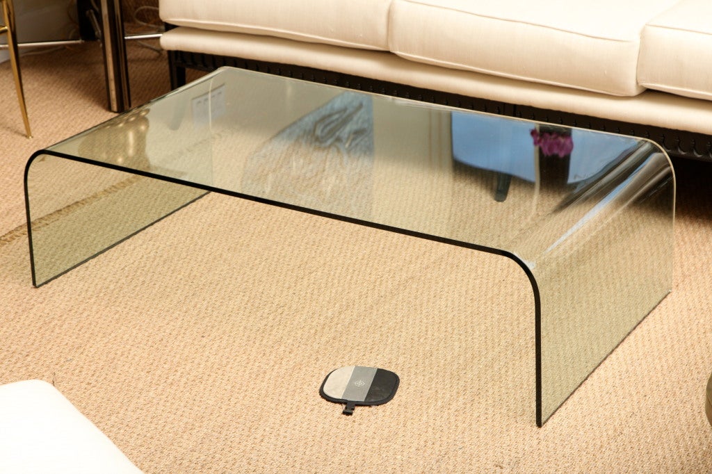 This infamous bent glass signed waterfall cocktail by Fiam for Pace is timeless and <br />
fits any period or movement. It was designed by Vittorio Levi in Italy. it is perfect with no chips... Amazing !!!! It just floats in a room....
