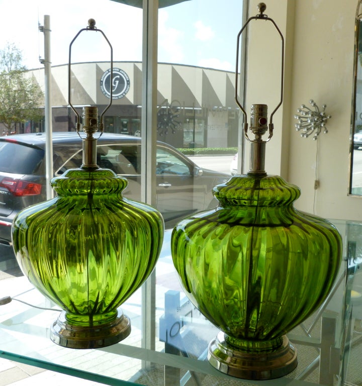 The fantastic shape of these glass lamps with nickel silver hardware and bases meets the amazing color of these monumental pieces... All newly re-wired... these will add 

a great  element to any room...