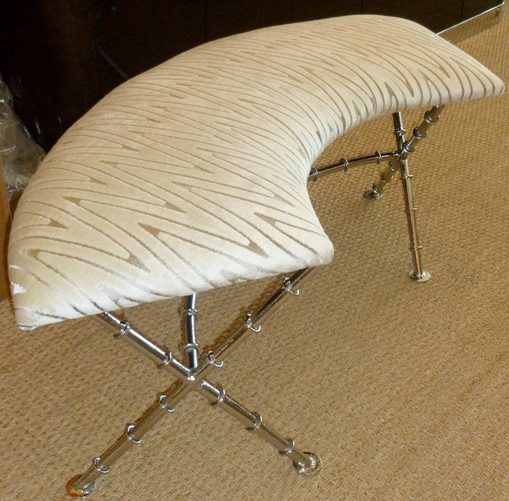 This Mid-Century Modern bench is a half moon knotted bamboo nickel silver bench that is upholstered in a beautiful and expensive champagne and silver cut velvet upholstery. It is very stunning! The base has been nickel silvered over powder-coated