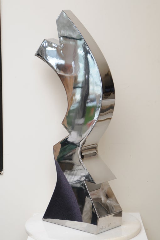 This abstract tabletop or pedastel sculpture from the 80's has a wonderful mirrored surface from the stainless steel. it has a great look from all different angles and directions.
it has the look of a substantial sculpture done by a substantial