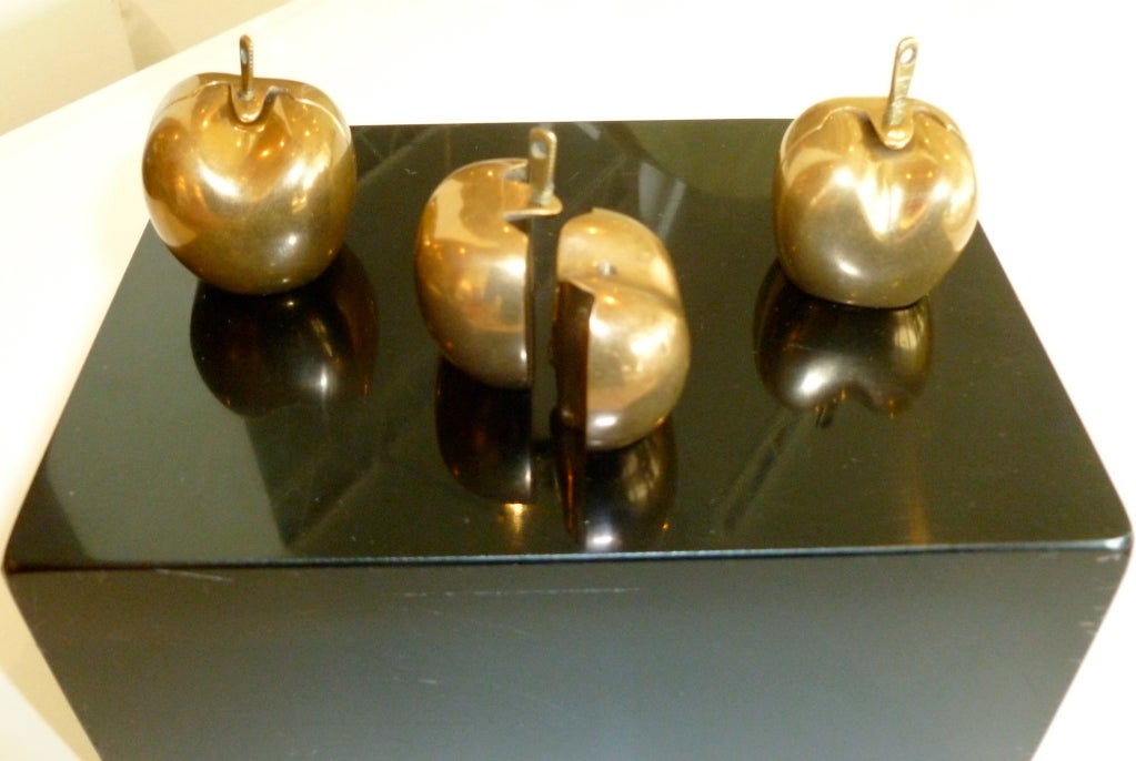This fantastic still life bronze puzzle sculpture belongs in the garden of Adam and Eve; where the fruit of the apple turns to life and love in the form of male and female torsos.  As you unlock the core of the apple which is the key inside the