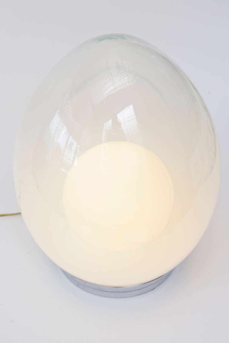 The shape of an egg meets the most sensual light, almost like a ray of amazing energy comes from a crystal like ball inside the lamps. It is a ball within a ovoid shape of glass.
Ethereal and great energy make this wonderful Italian Murano