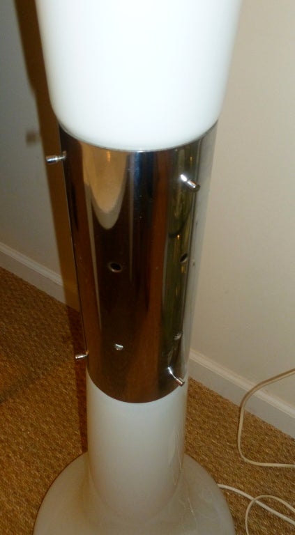 This wonderful sculptural Italian Murano glass large floor lamp by Carlo Nasson has the most beautiful ambient standing floor lighting. There is a stainless steel connector in the center, and a stainless steel lower base, and it can  be with both
