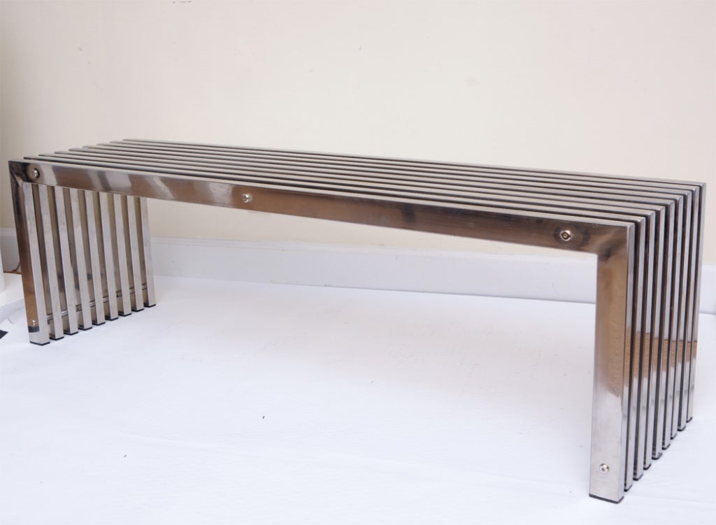 Wonderfully made and incredibly heavy stainless steel bench make up this 9 slats
that look like sculpture. It has recessed hex screws that give way to European vintage. The tubular stainless steel 1