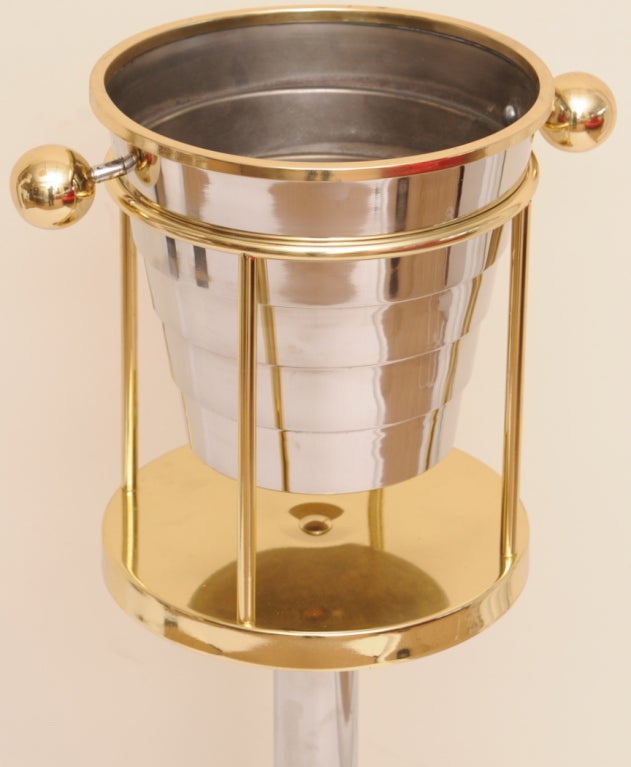 Chrome and Brass with deco inspired tiers make this great size champagne /wine stand perfect for popping that cork! The inside of the bucket has some wear. it has not been re silvered...
Larry Laslow for Towle; 1983 signed the bottom... this photo