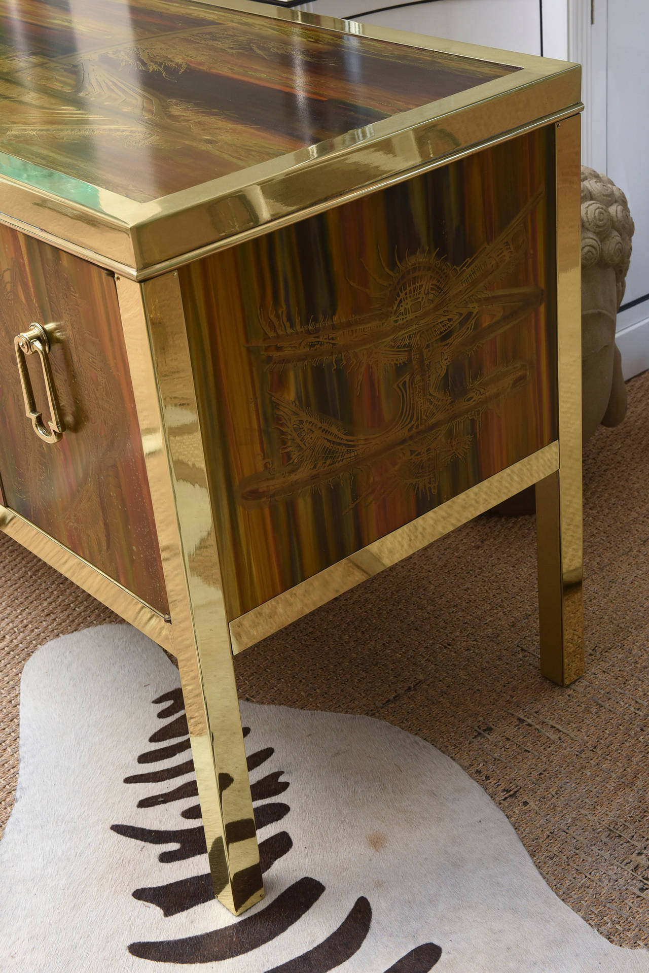 This exquisite Bernard Rohne masterpiece is art and sculpture all in one as a cabinet, as a console or buffet. It is an acid etched abstract design; every cabinet is different as it is all hand done. The solid brass original handles and frame have