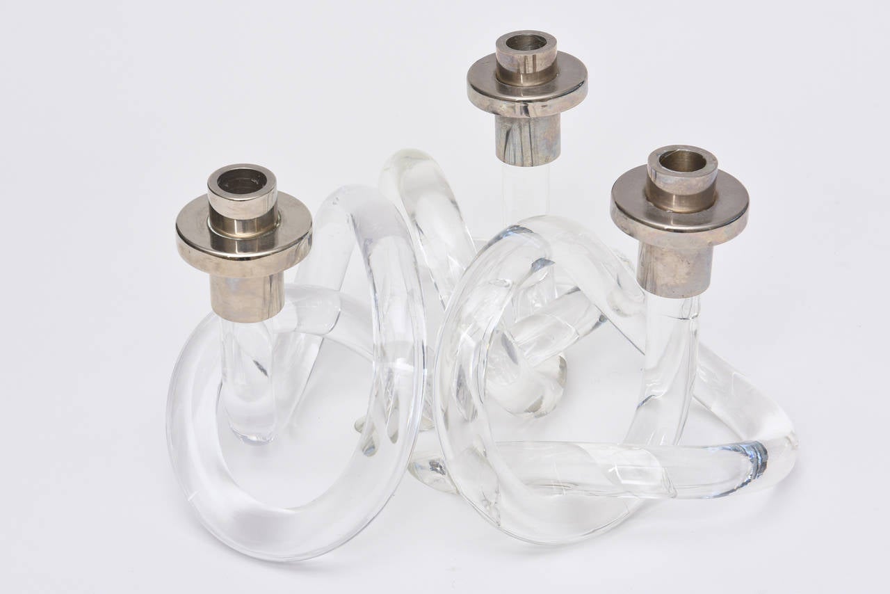 These trio of intersecting candlesticks are a combination of lucite and chrome tops. The  infamous Dorothy Thorpe pretzel style is fun!
They can be used in different formations to create different sculptural shapes; such as one inside the other...