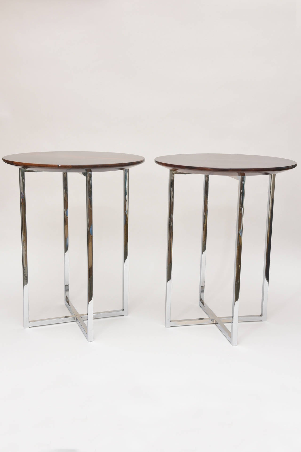 These sculptural versatile, stunning and timeless vintage side tables of Milo Baughman have the most beautiful exotic wood tops. The wood is rosewood of Italian origin. They have a high polish on top. The chrome bases have all been polished. They