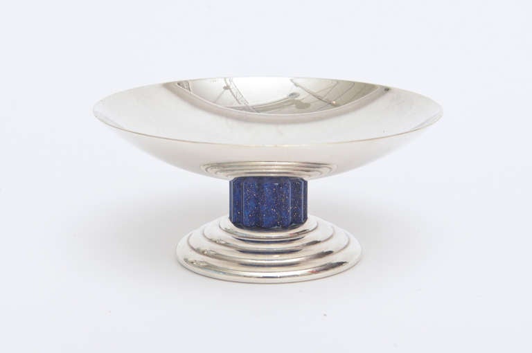 This wonderful french art deco bowl signed by Jean Puiforcat  is a small gem...
The blue lapis that sits atop the stepped base is regal.