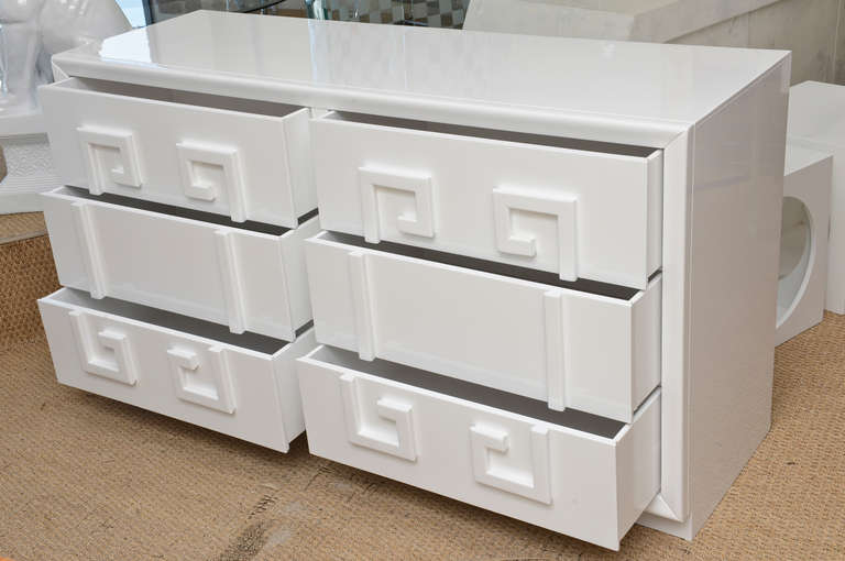 The raised greek key pattern of the white lacquered drawers gives this wonderful dresser dimension. All newly restored and white lacquered.
Classic!!!
It is in the style of Kittinger.