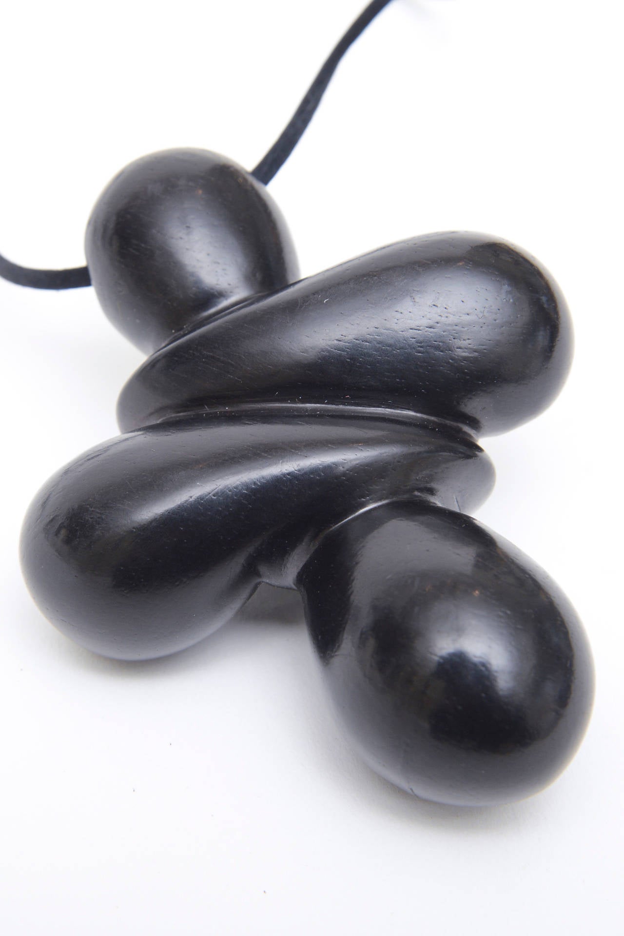 Sculptural and dimensional is this ever present form of a necklace made by the NY contemporary jewelry designer; Patricia Von Musulin.  It is ebony wood that hangs on a satin chord with an ebony wood  adjuster.  It is tres chic and very sculptural.
