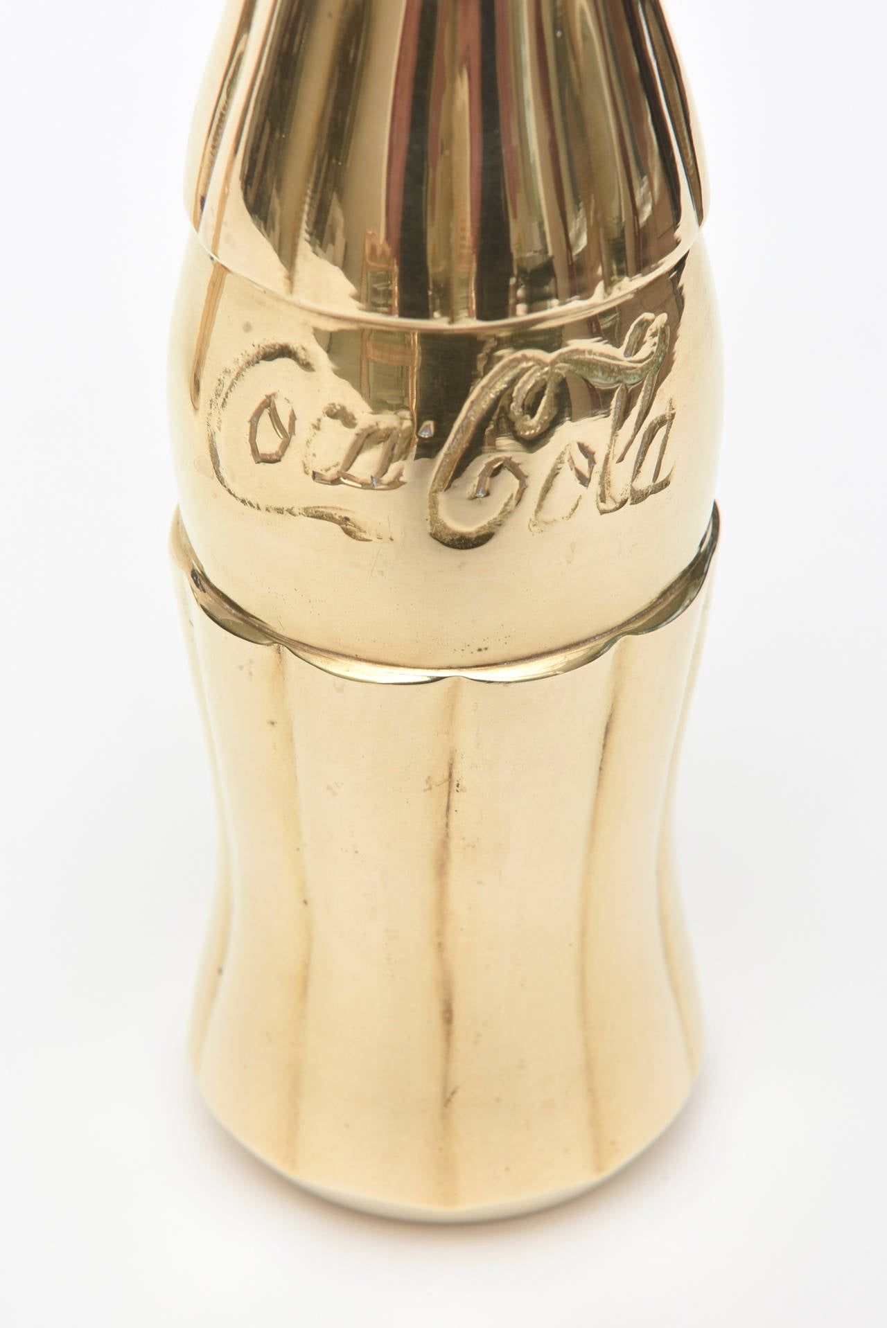 These pop art coke bottles are high polished brass. Very fun! They have good weight to them!
They can go into a nice Lucite box to give them more of an edgy art piece.

PLEASE NOTE: THESE WILL BE ON THE SATURDAY SALE FOR 1 WEEK ONLY THRU AUGUST