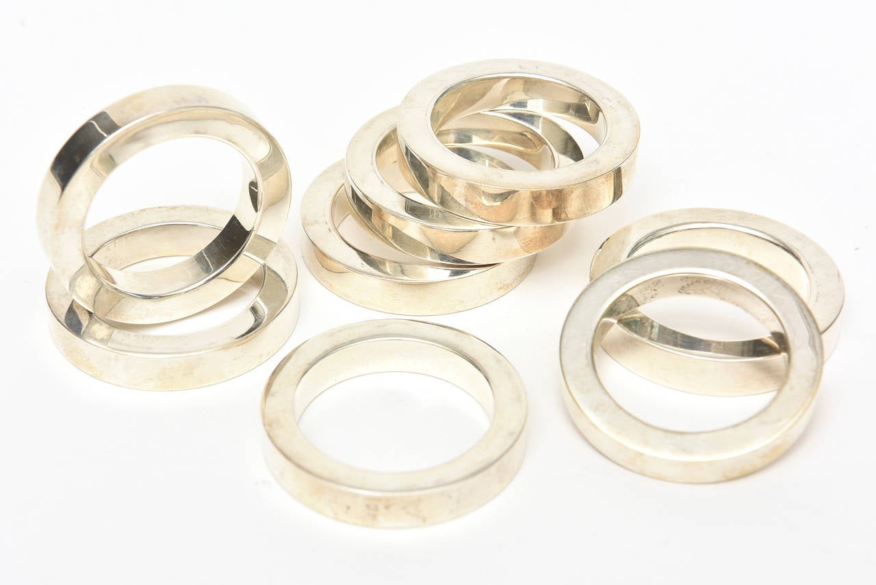 This lovely set of eight silver plate modernist and vintage circular napkin rings are of 
simple yet modern design.
They are timeless and forever and will make any table setting beautiful.
This set cannot be broken up; sold as is.
They have an